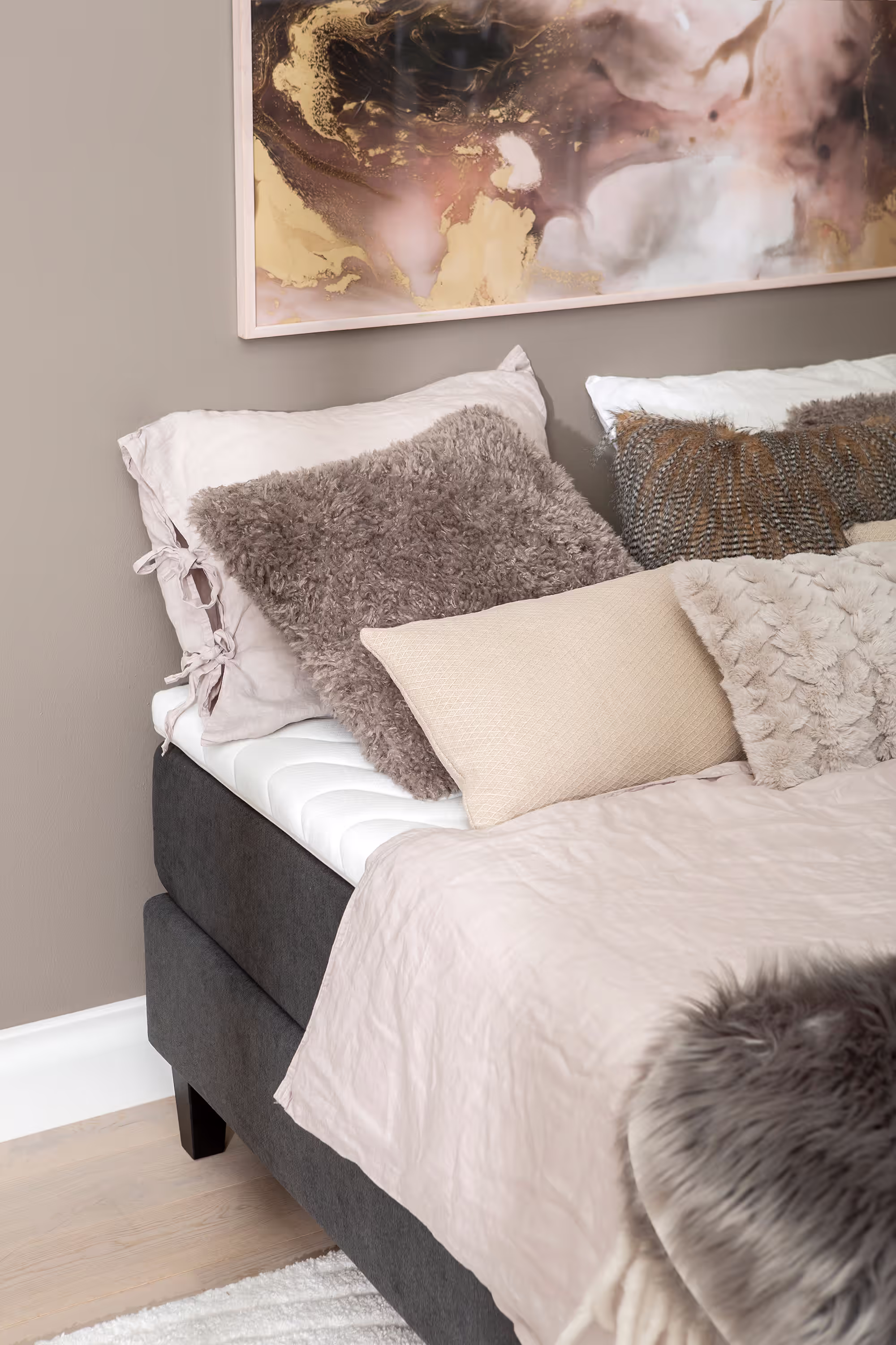 View of the bed legs stained oak color in cone shape, adding a light, elegant touch to the Moon Gold bed.