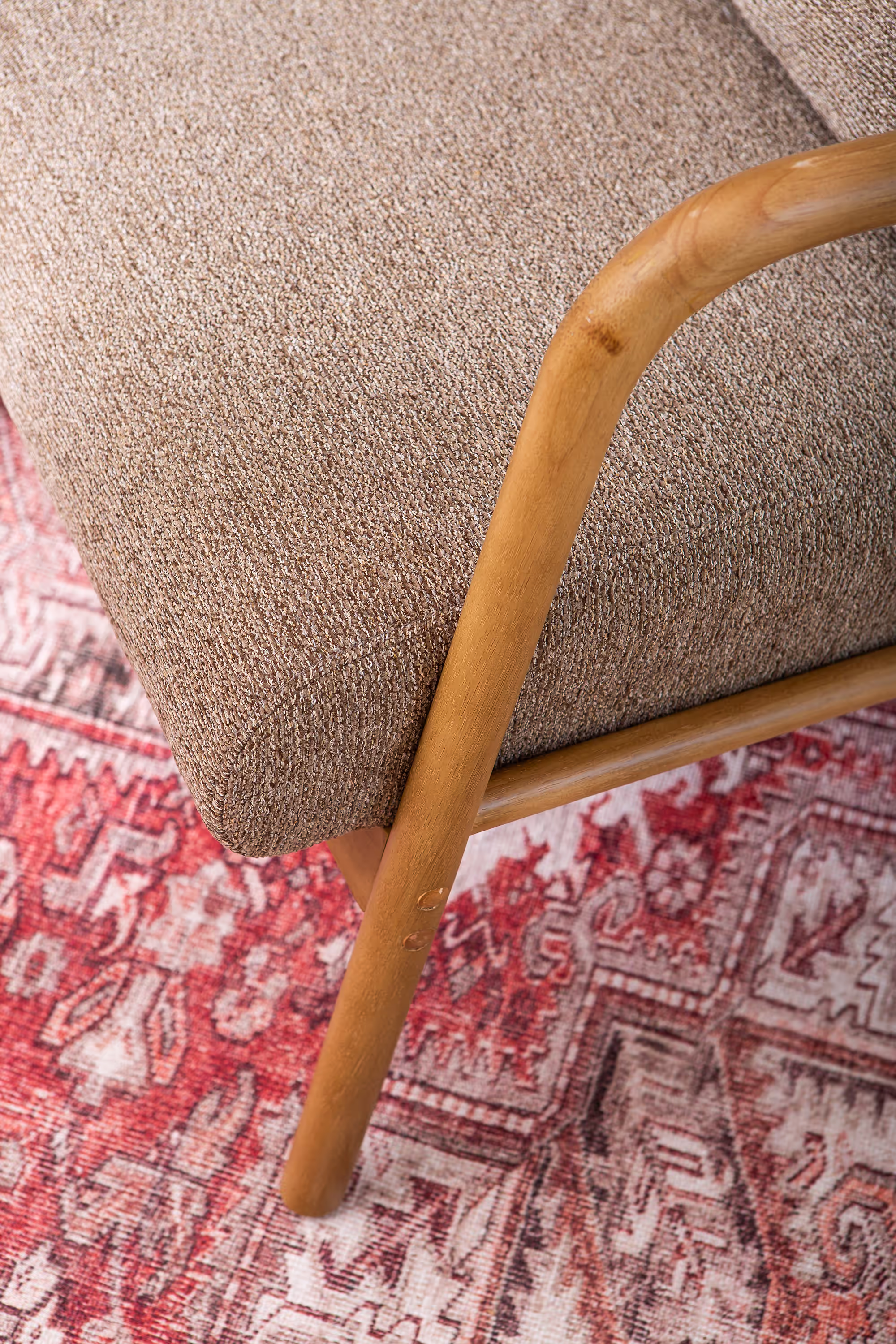 View from above showing Dove armchair seat and surrounding polished rubberwood frame