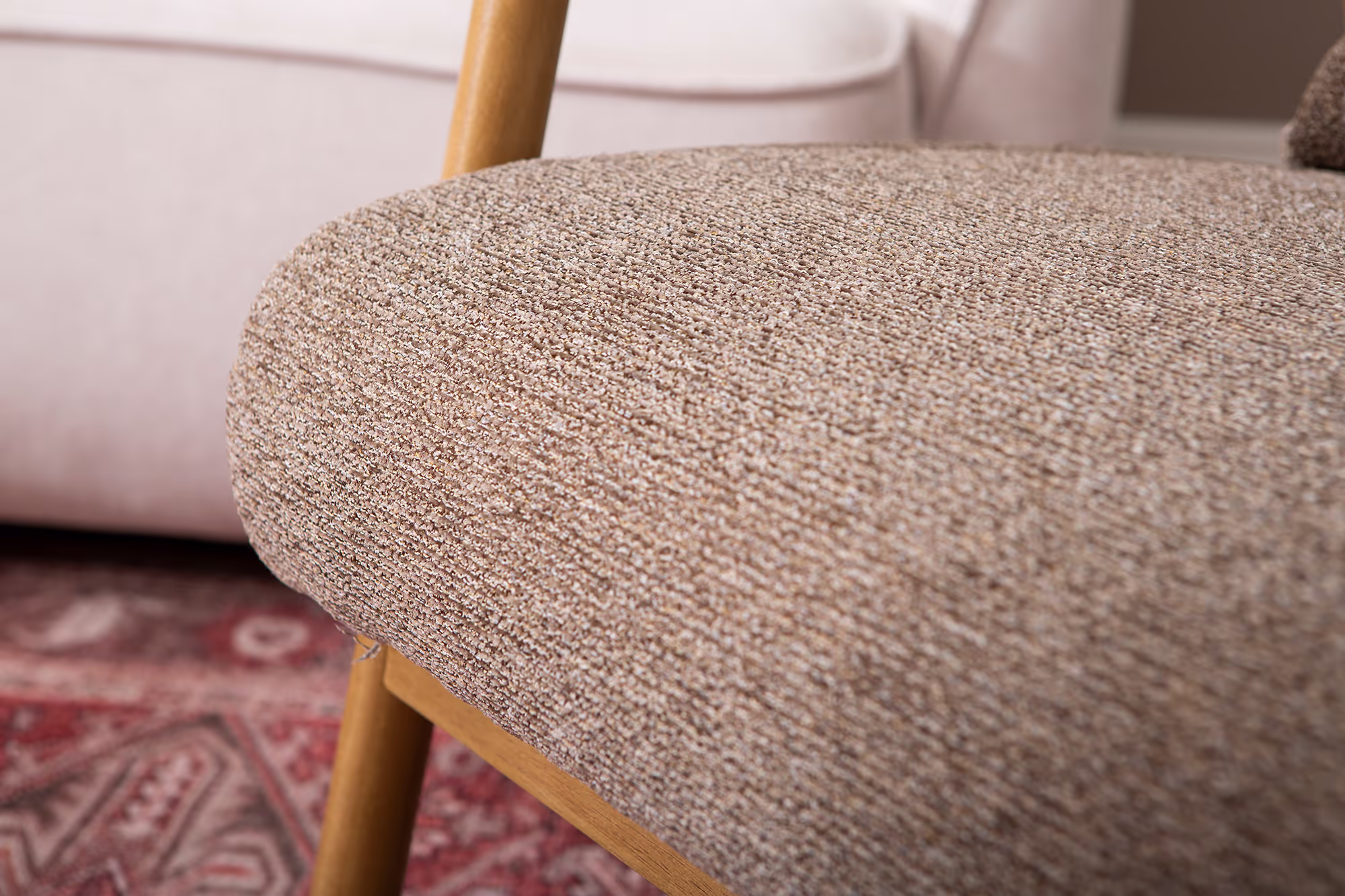 Dove armchair with complementary cushions in a cozy arrangement