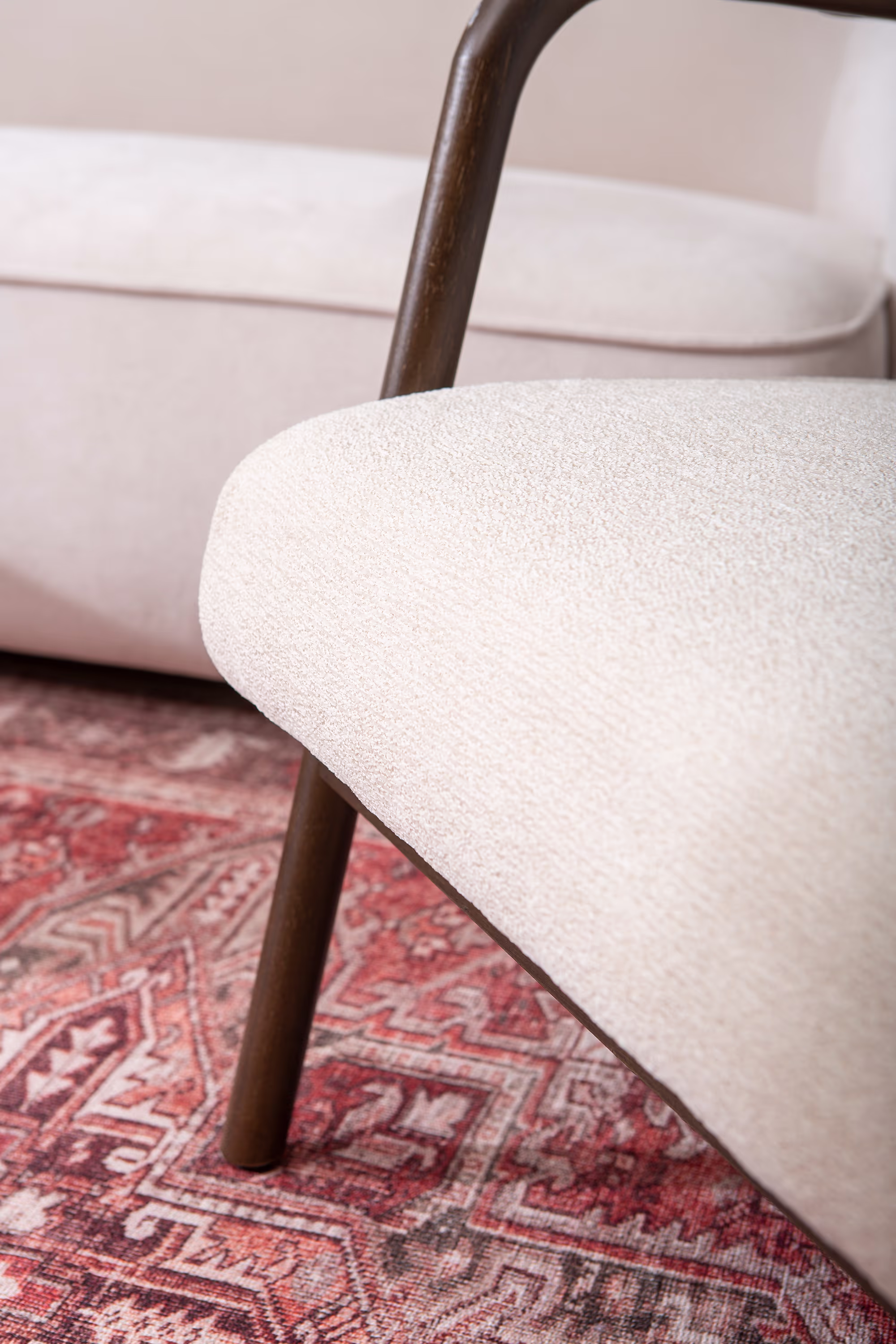 Dove armchair in a cozy corner setting with soft lighting