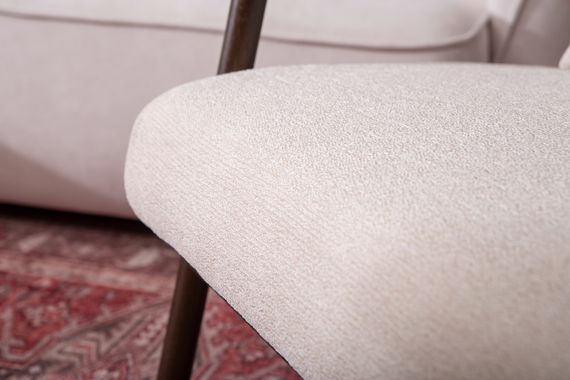 Close-up of fabric texture on Dove armchair’s beige upholstery