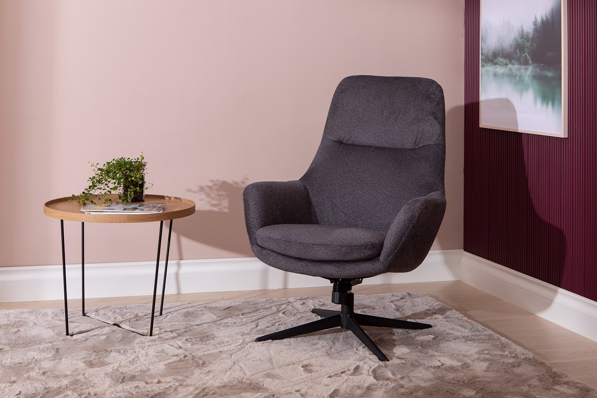 Closeup of the dark gray textured fabric upholstery on the Blow TV chair