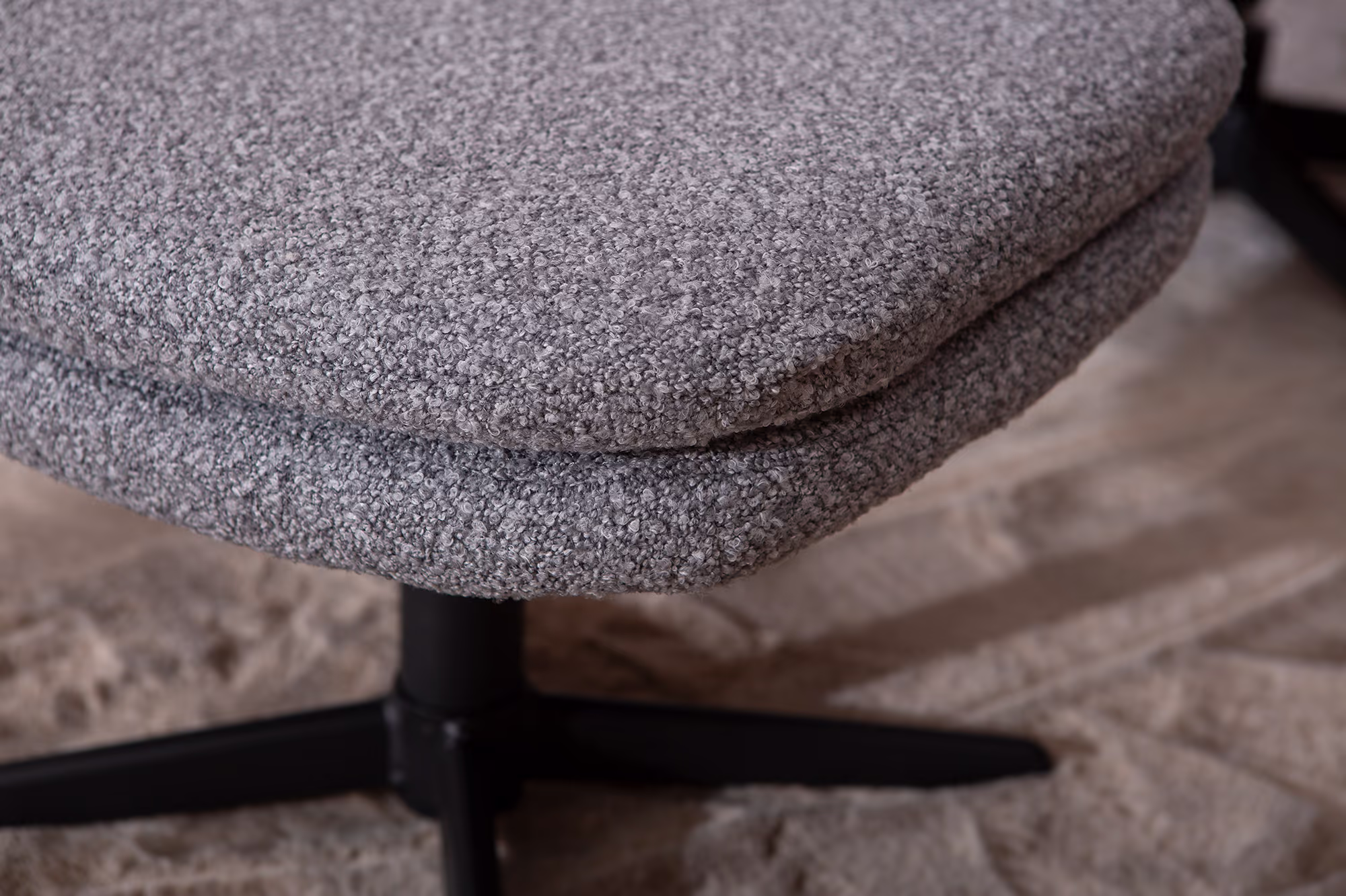 Top view of Breeze ottoman showcasing durable gray fabric and solid black legs