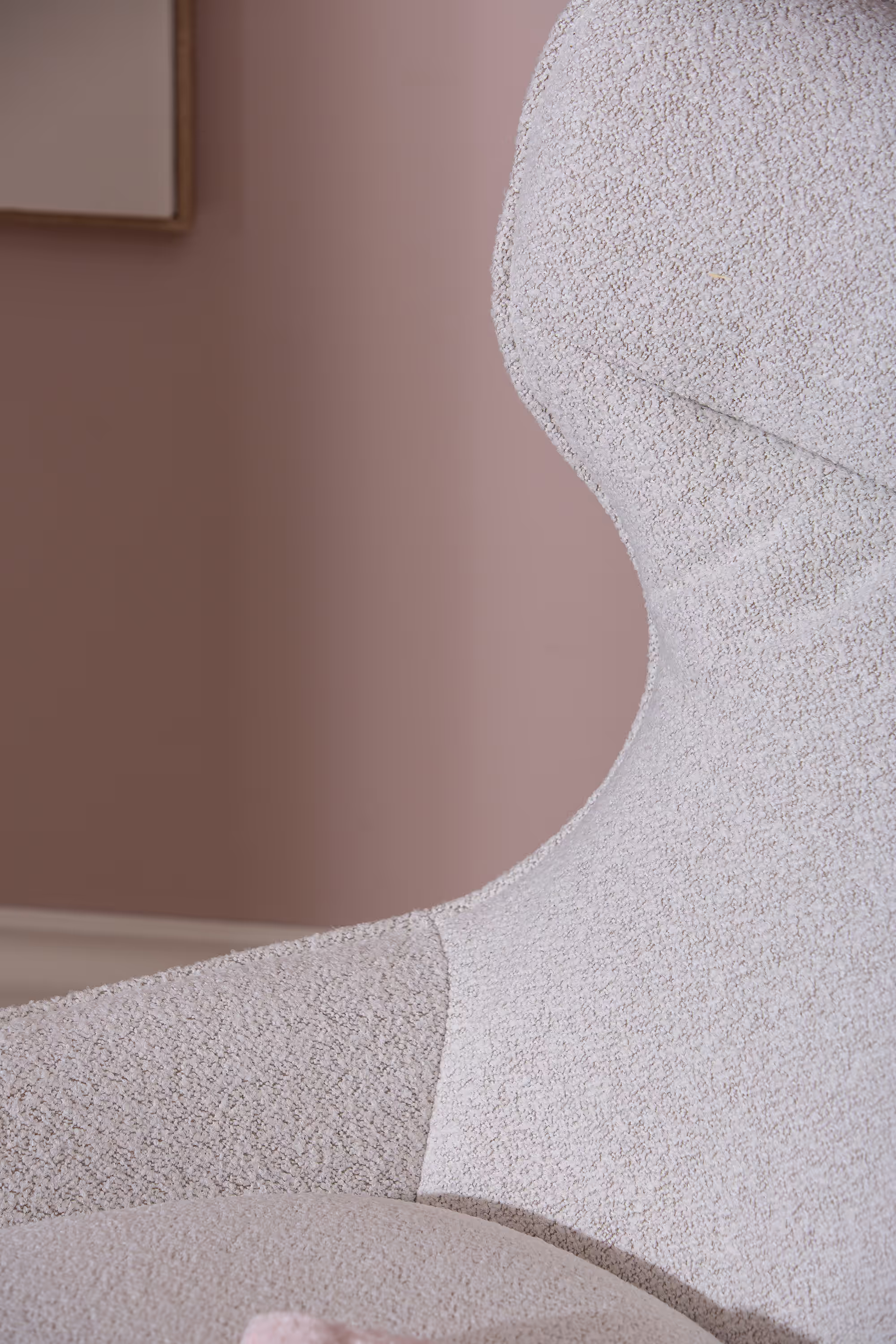 Rear view highlighting the sleek silhouette and ergonomic high backrest of the Breeze TV chair.