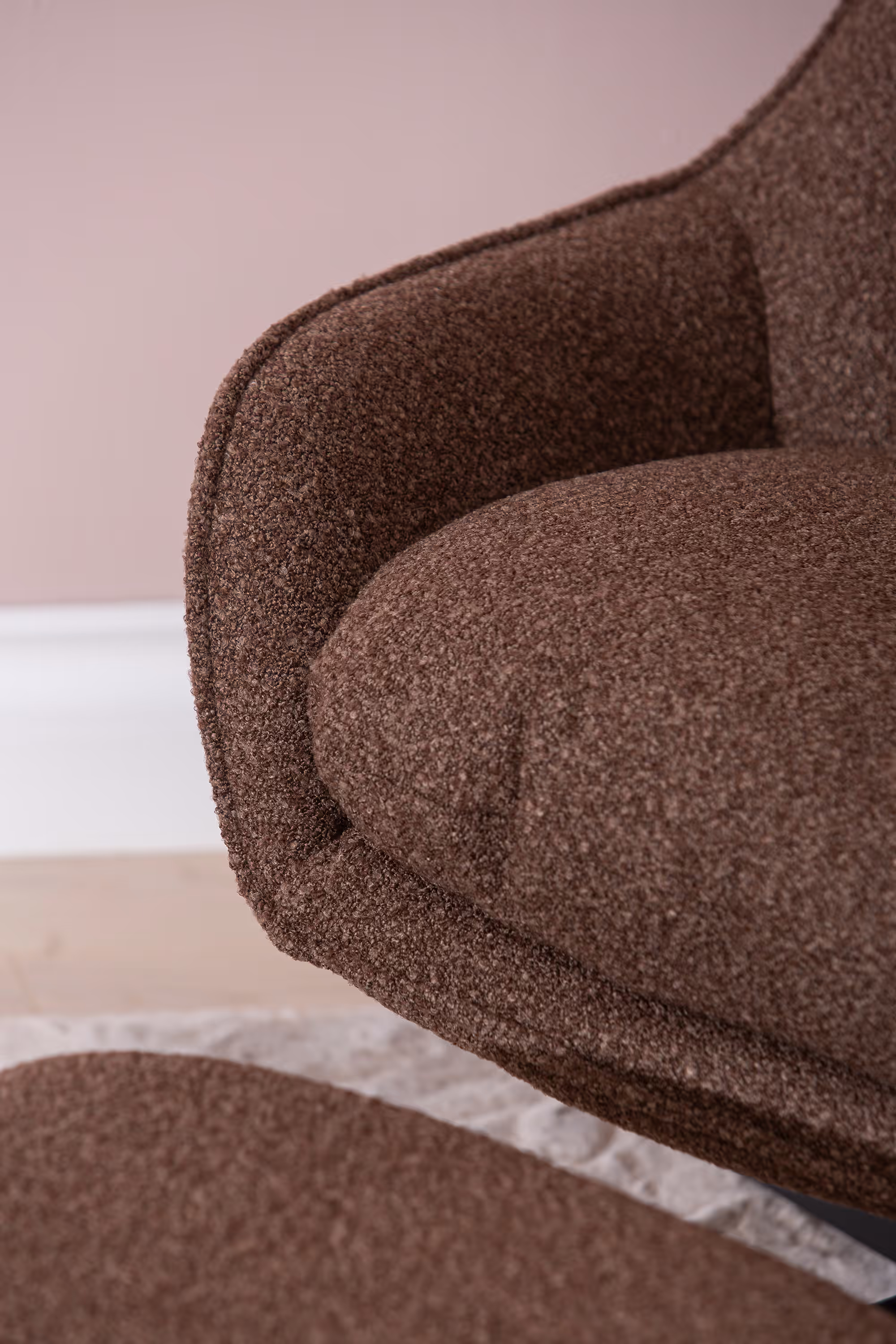 Angle showing ergonomic seat and ottoman supporting relaxed leg positioning on Breeze TV chair.