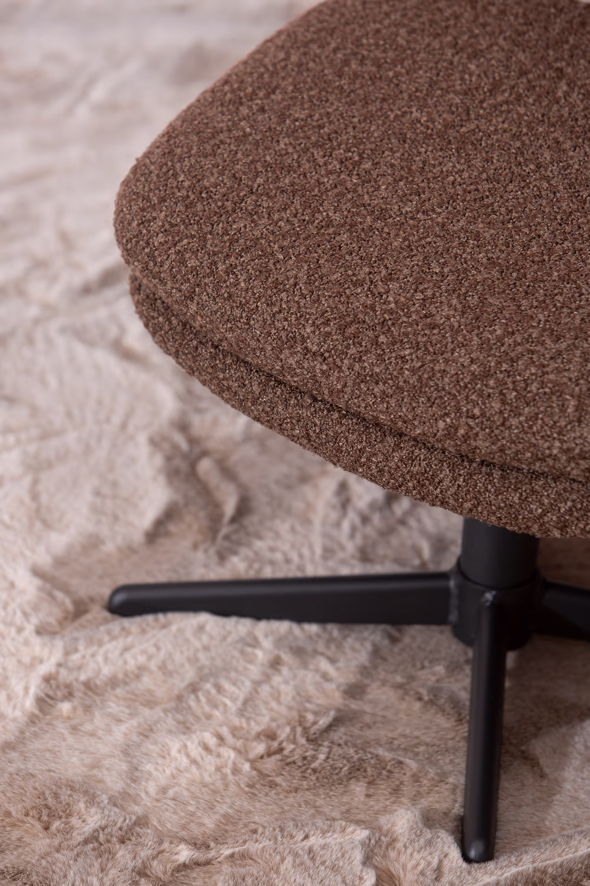 Breeze TV chair with ottoman in brown fabric set against a cozy interior background.