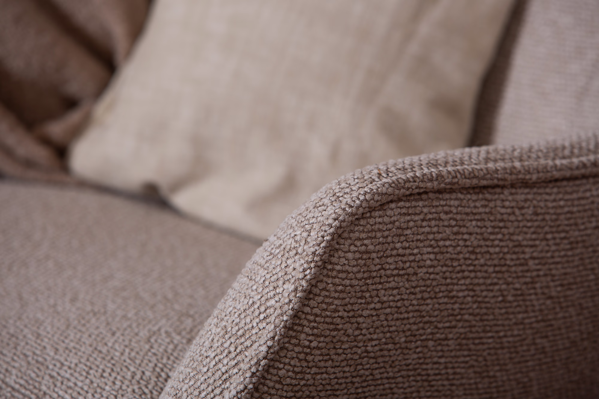 Wind TV chair with ottoman showing beige fabric texture and sleek latte wooden legs