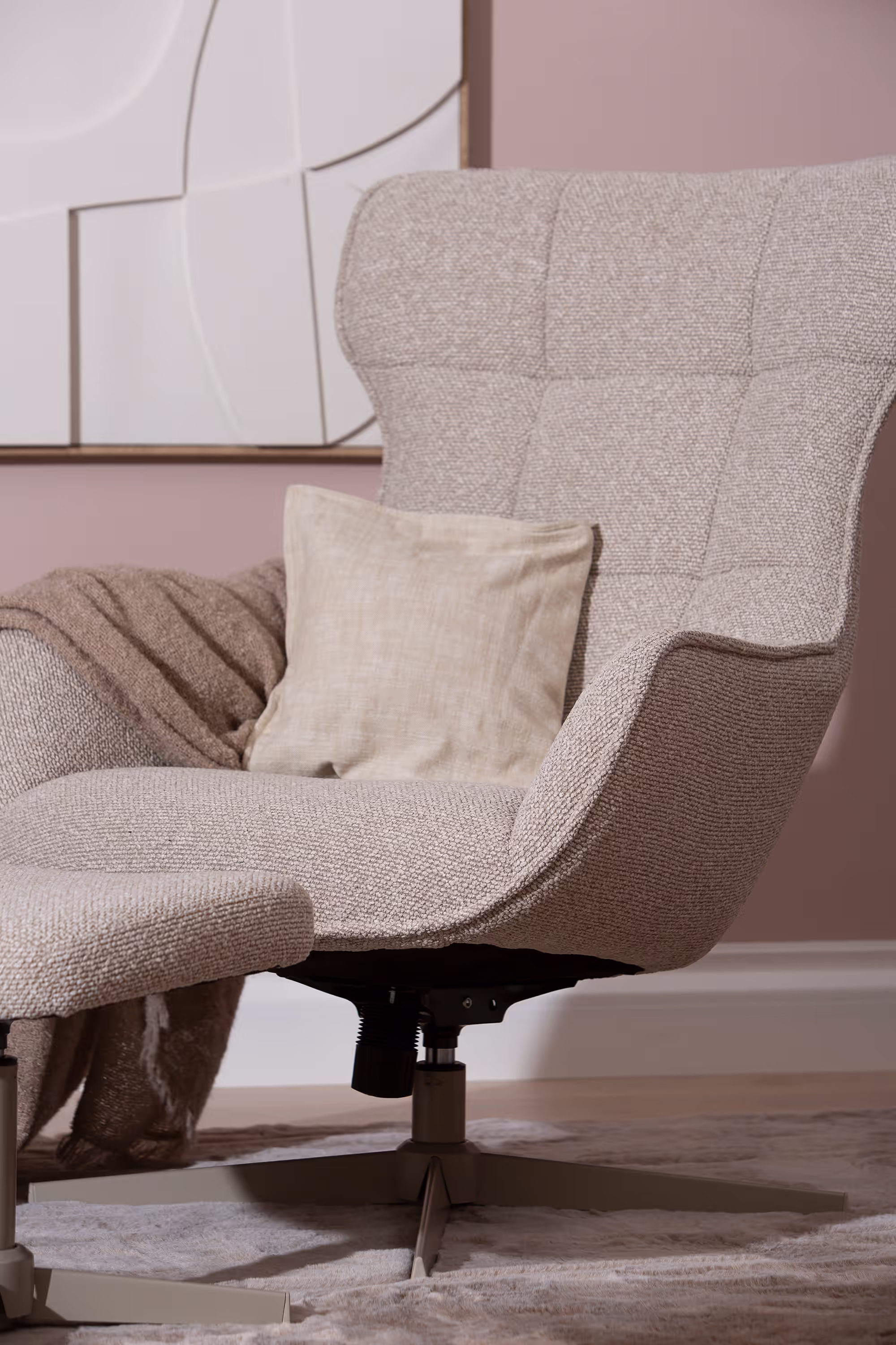 Wind TV chair with ottoman in ambient light, highlighting warm beige upholstery