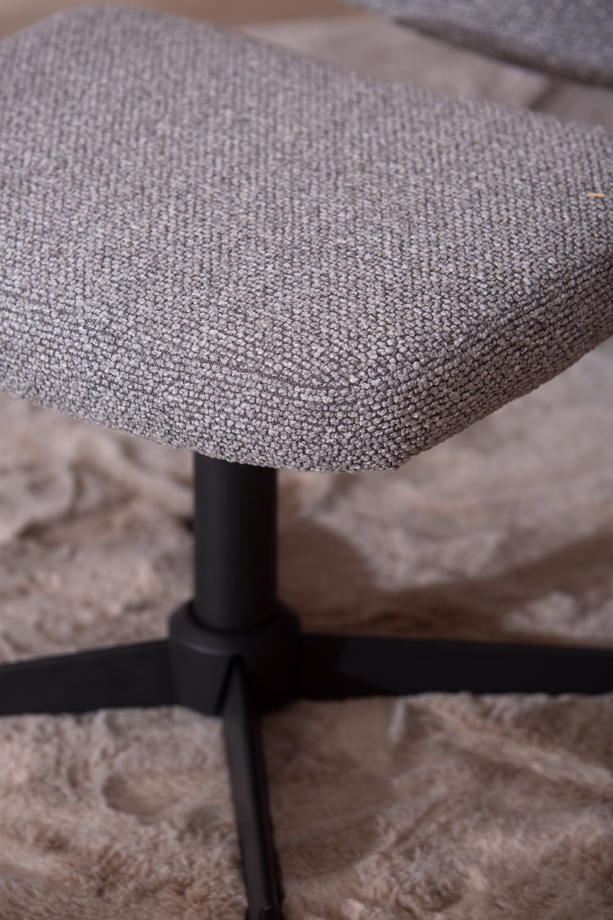 Front view of Wind TV chair showing wide seat and high backrest in light grey fabric
