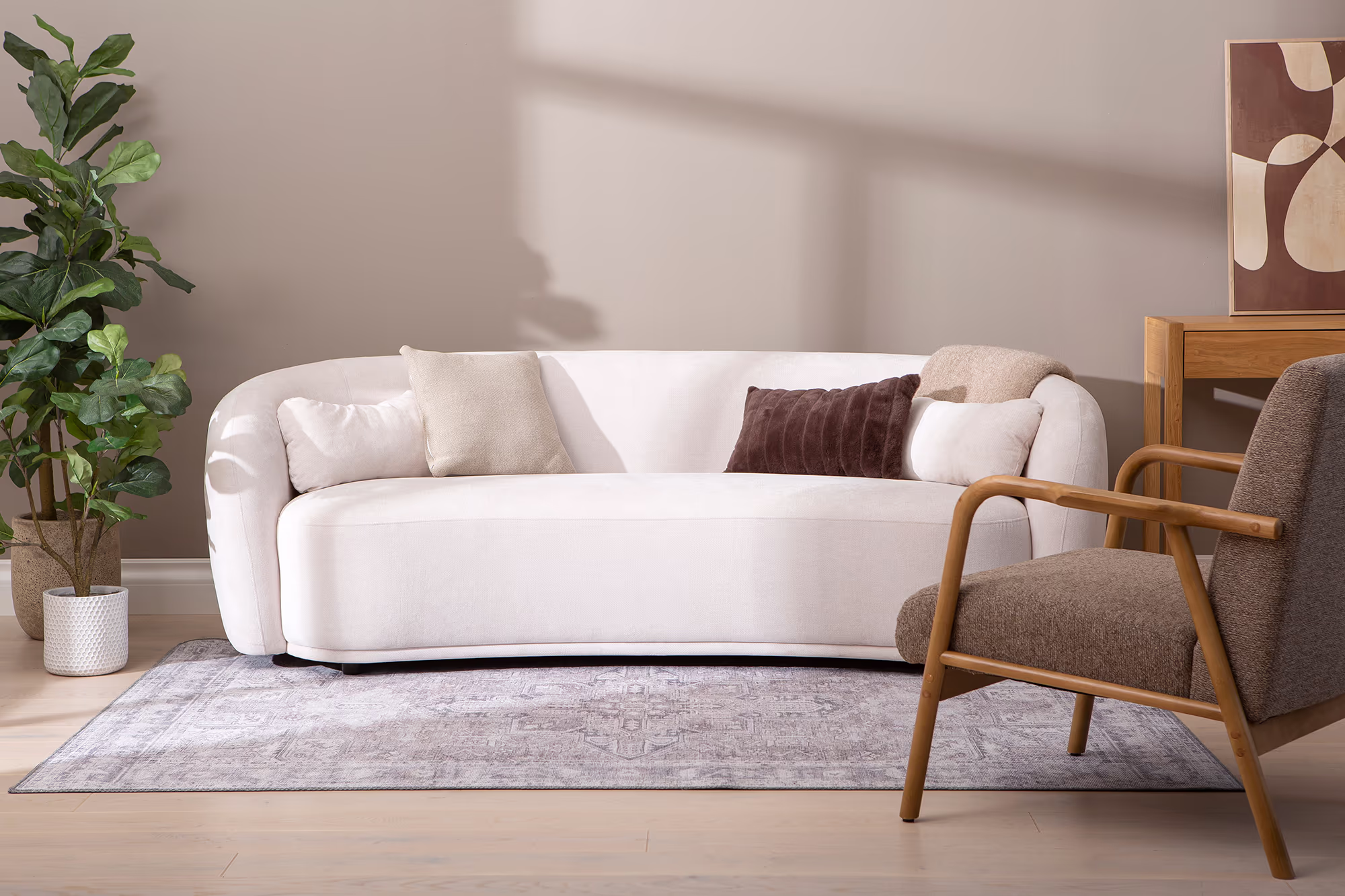 Freedom sofa legs detail, highlighting sturdy construction supporting white upholstery