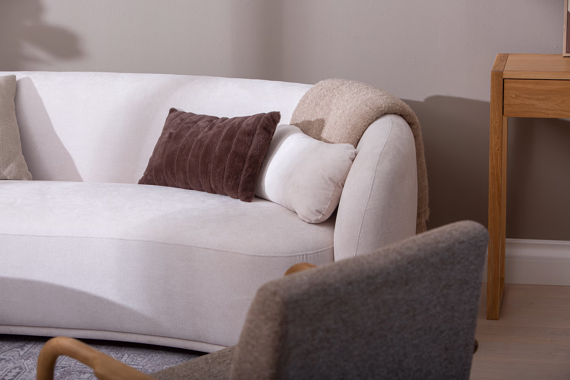 Close-up of the Freedom sofa’s white upholstery texture and comfortable seat cushions