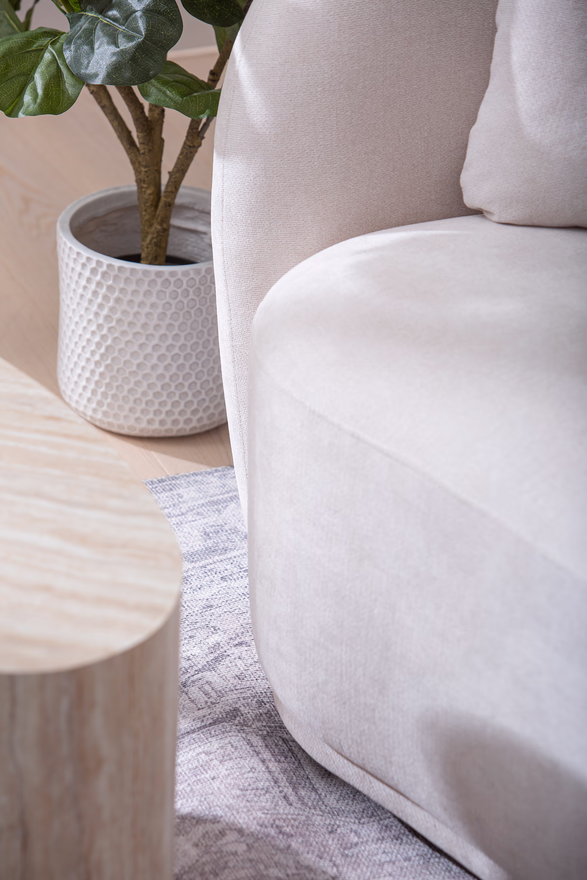 Freedom 3-seater sofa highlighting its solid, low-profile frame and sleek armrests in white