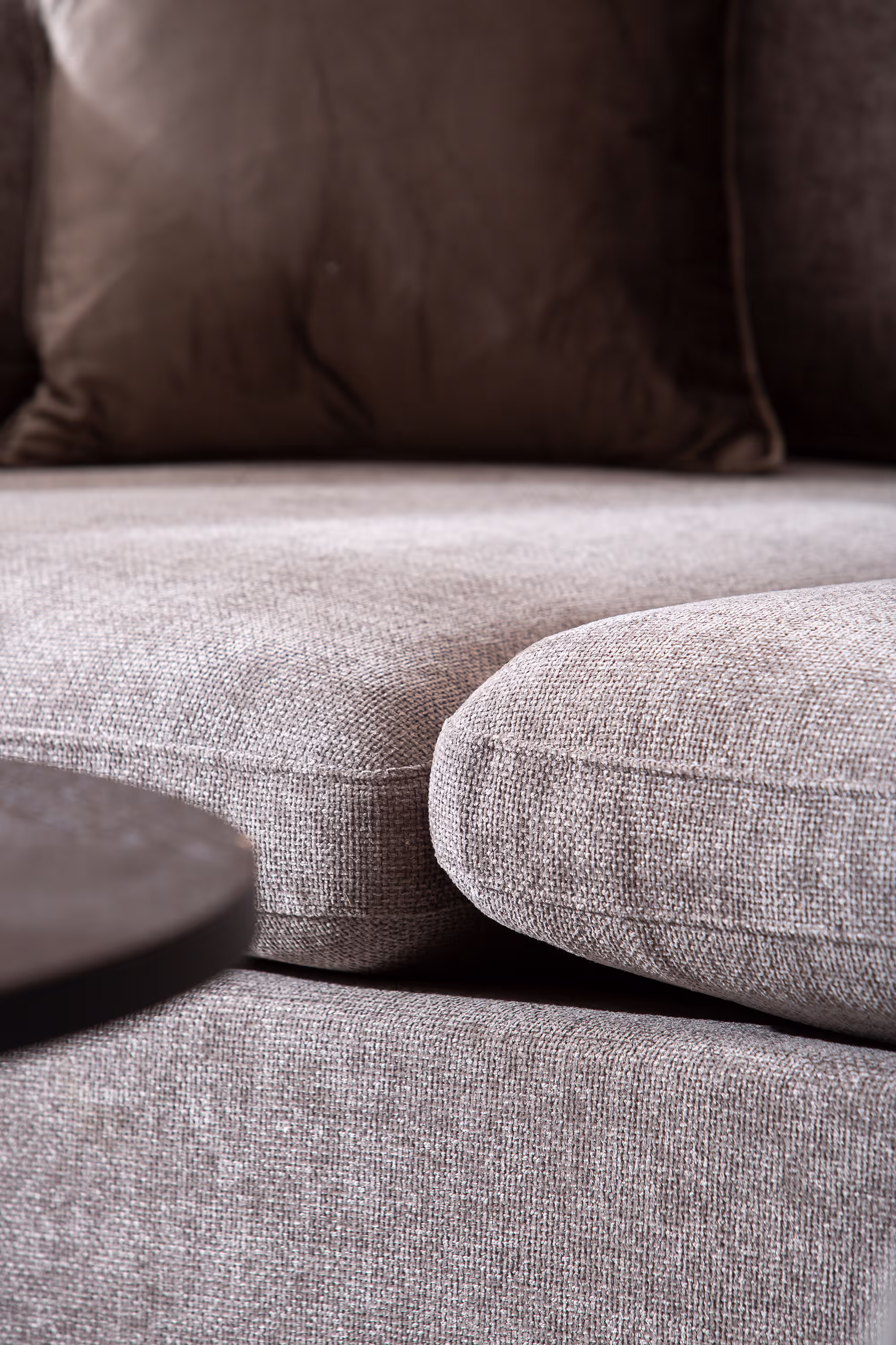 Heaven grey chaise sofa in a contemporary lounge environment with soft lighting.