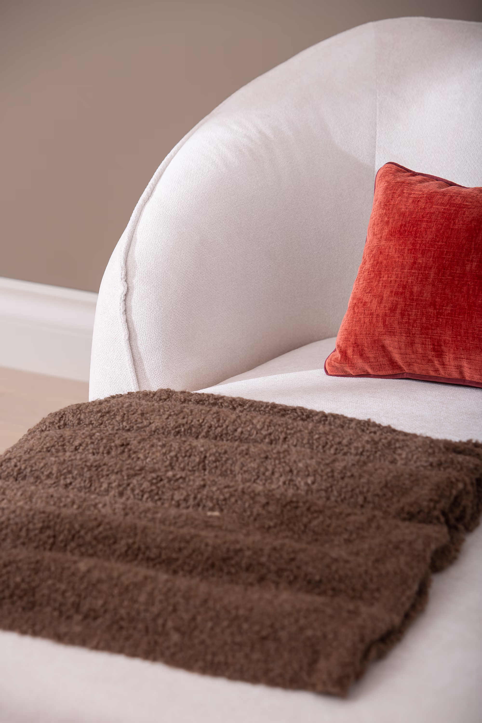 Joy sofa's chaise section showing comfortable padding and minimalist design in white color