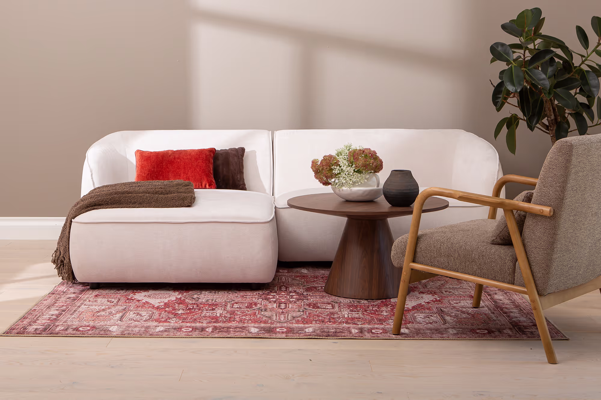 Back view of the Joy left chaise sofa highlighting its sturdy frame and soft white cover