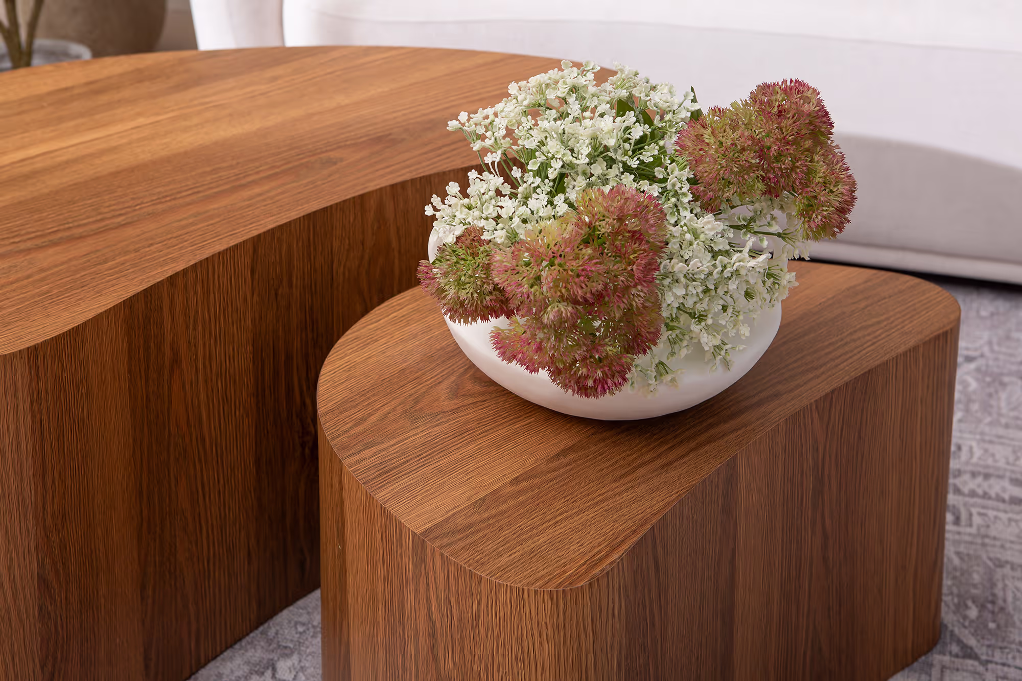 Island series table set arranged in a cozy living room environment, complementing soft textiles and neutral colors