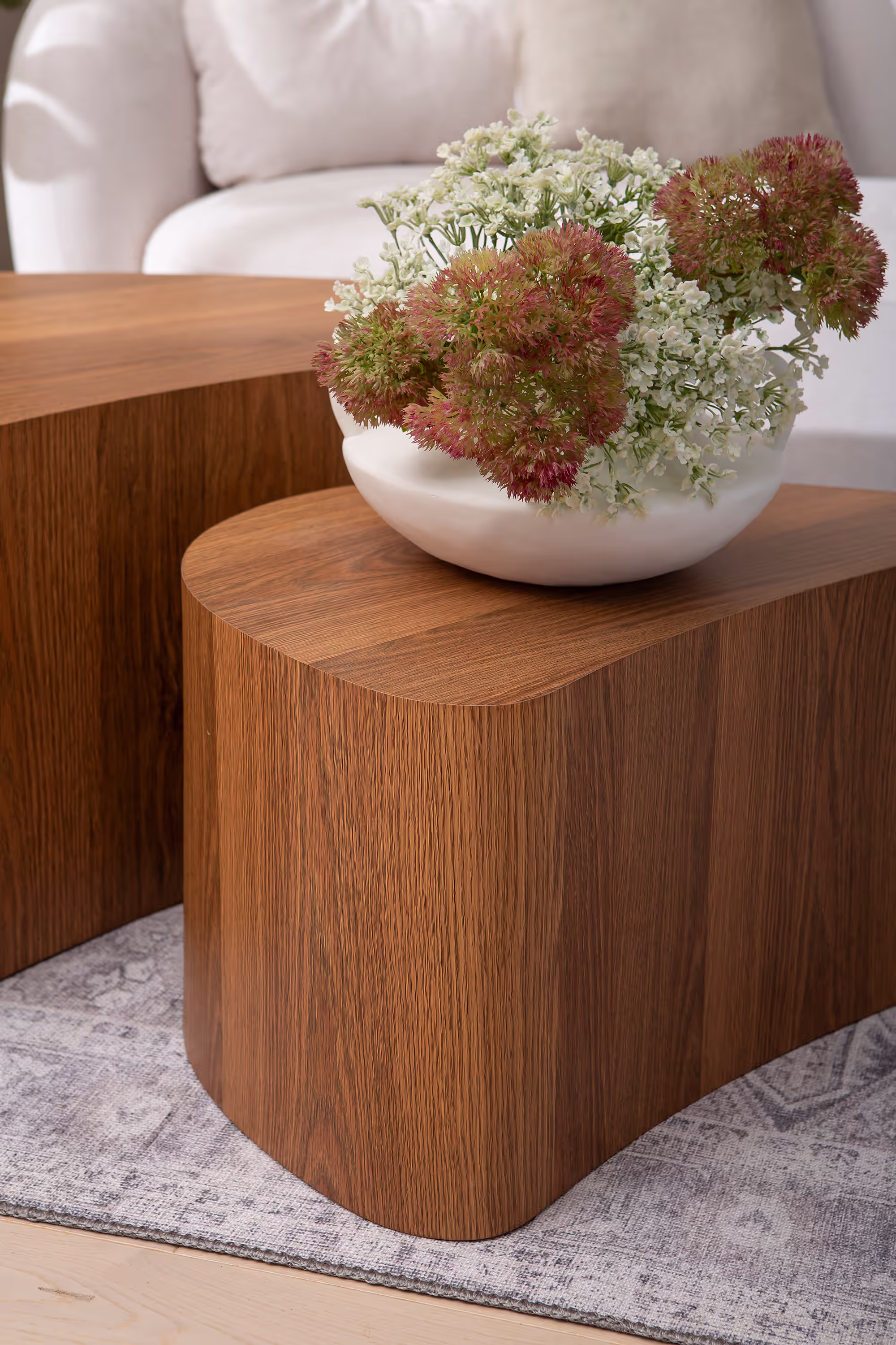 Detailed image of the American Walnut finish wood grain texture on the Island series table surface