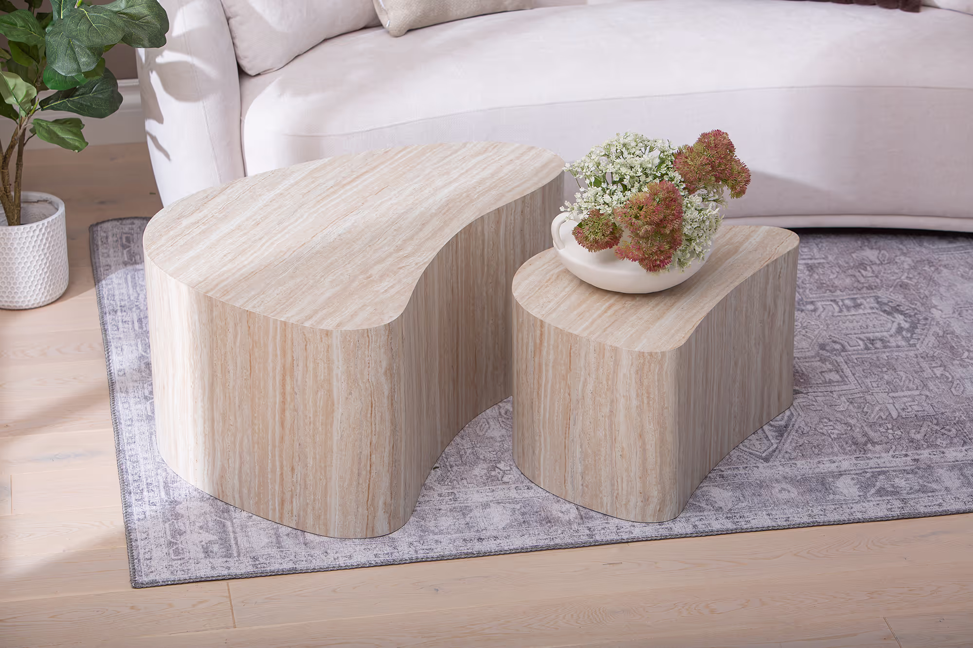 Perspective view highlighting the asymmetrical stacked design of the two tables in the Island series.