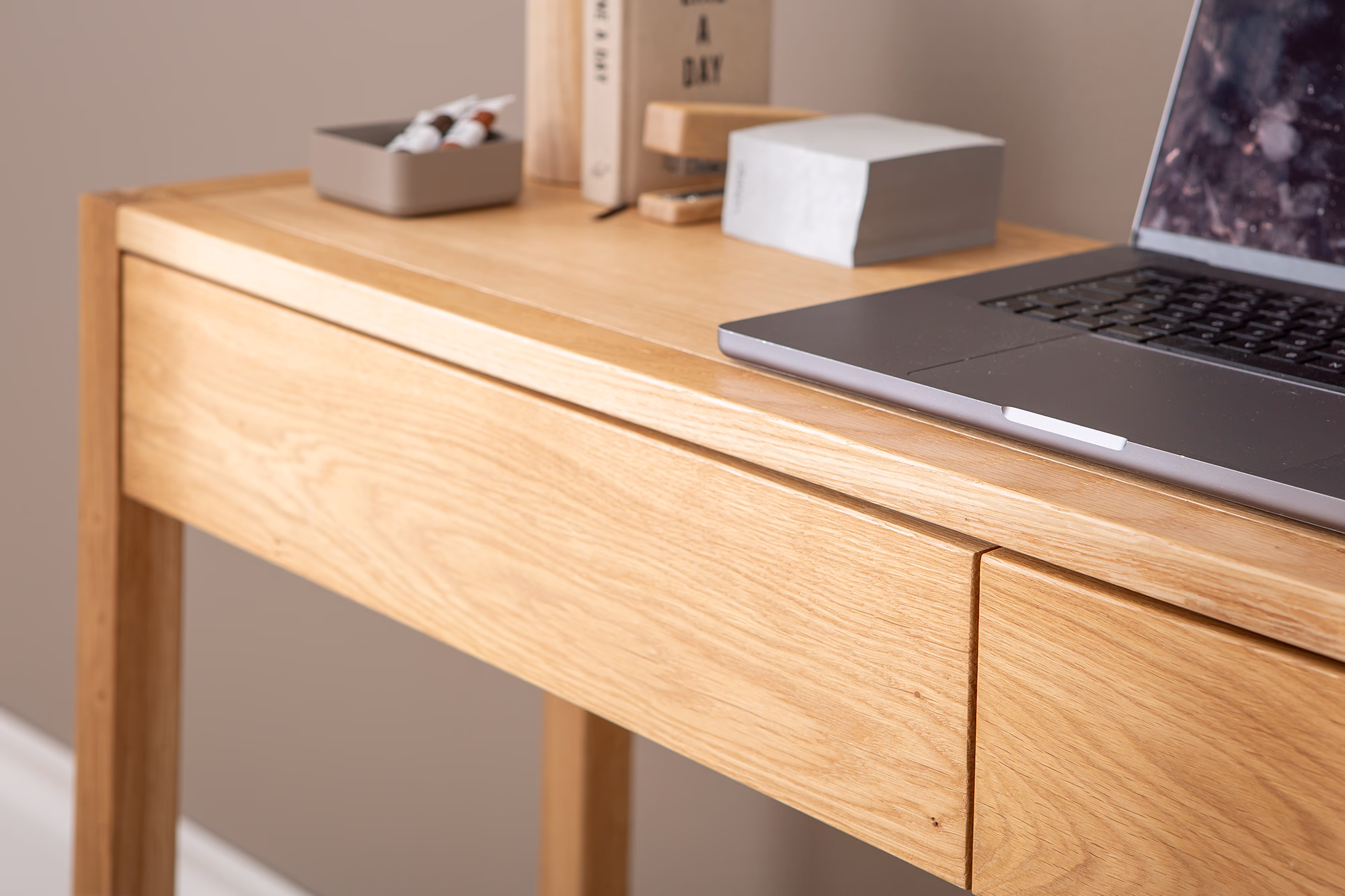 Side view of the oak console table showing solid oak legs and smooth veneer surface