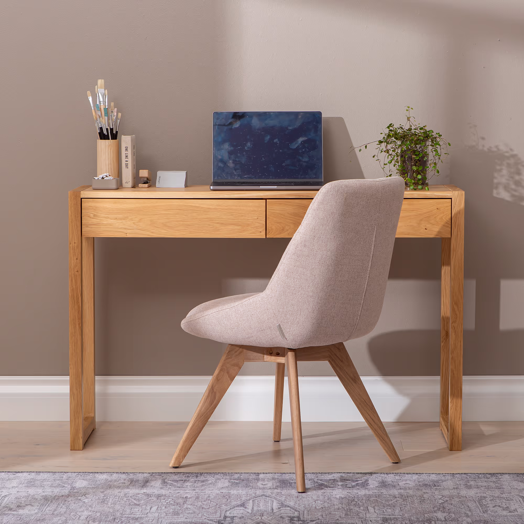 Antique style oak console table from a front angled perspective in ambient light