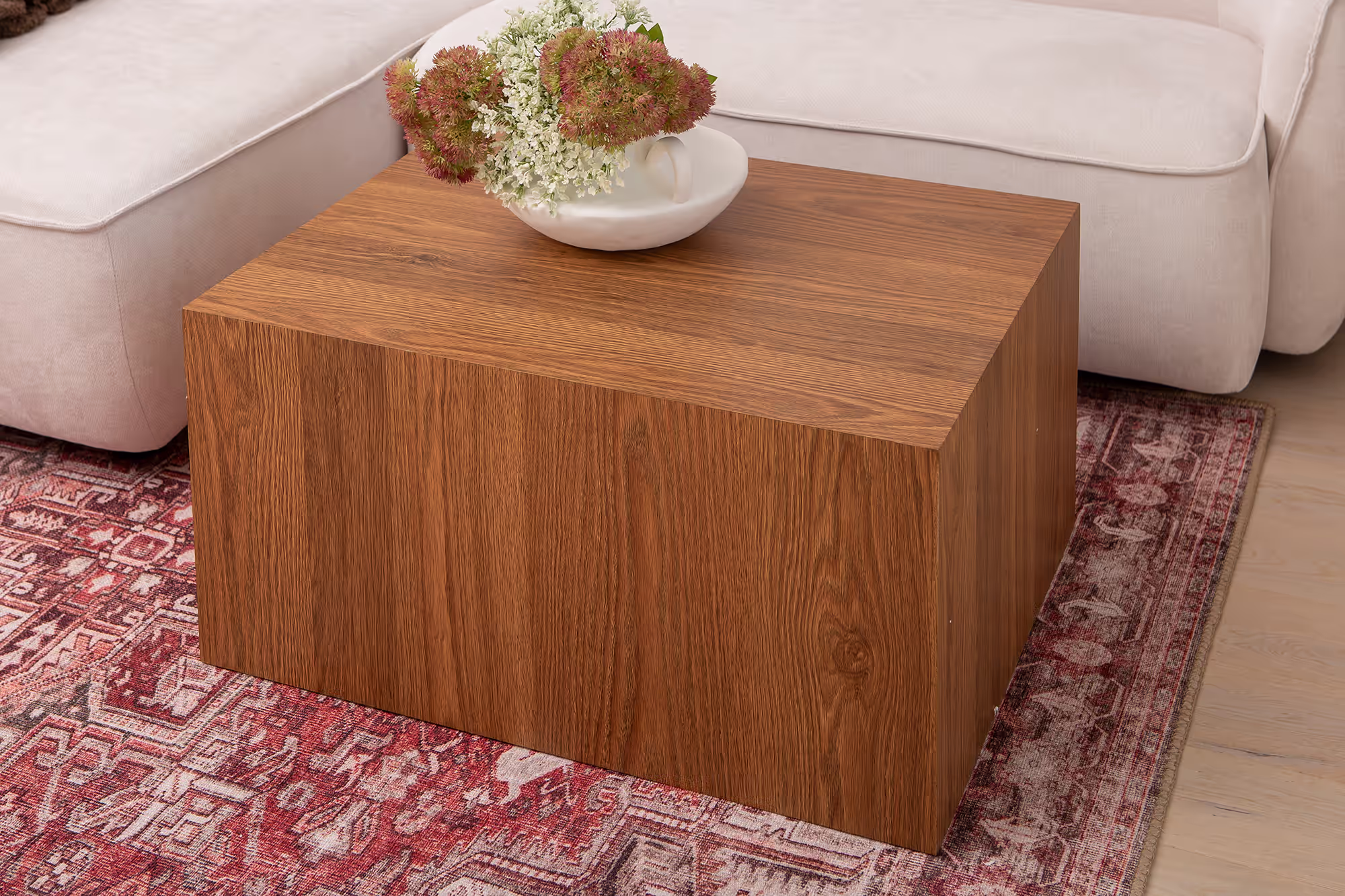Side angle view of Reef coffee table highlighting smooth wood texture and sturdy legs