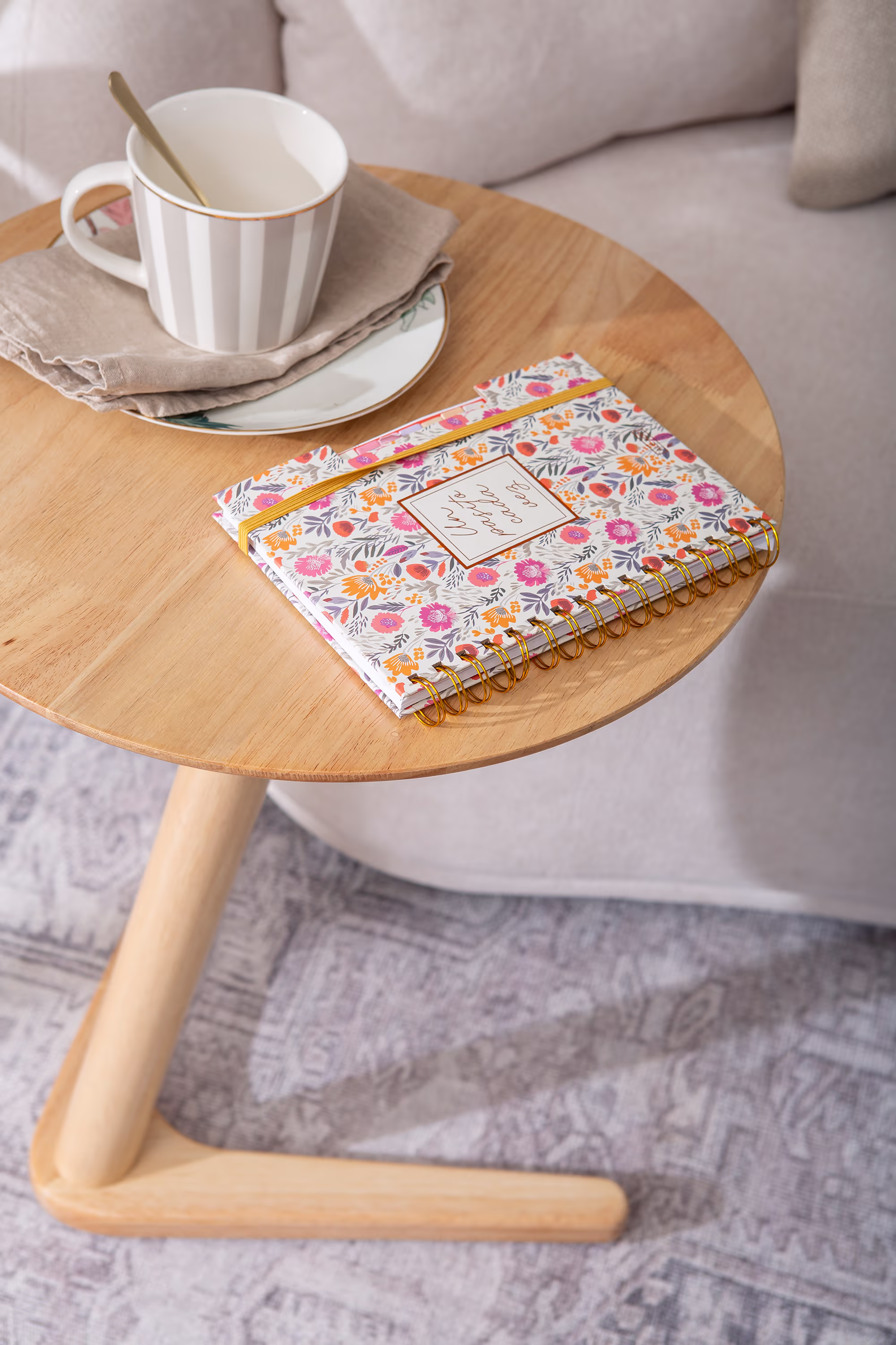 Swallow side table demonstrating versatile use as a coffee or side table in neutral décor